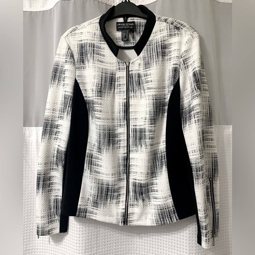 Black and white Size 14 Frank Lyman jacket. Easy to clean polyester fabric.